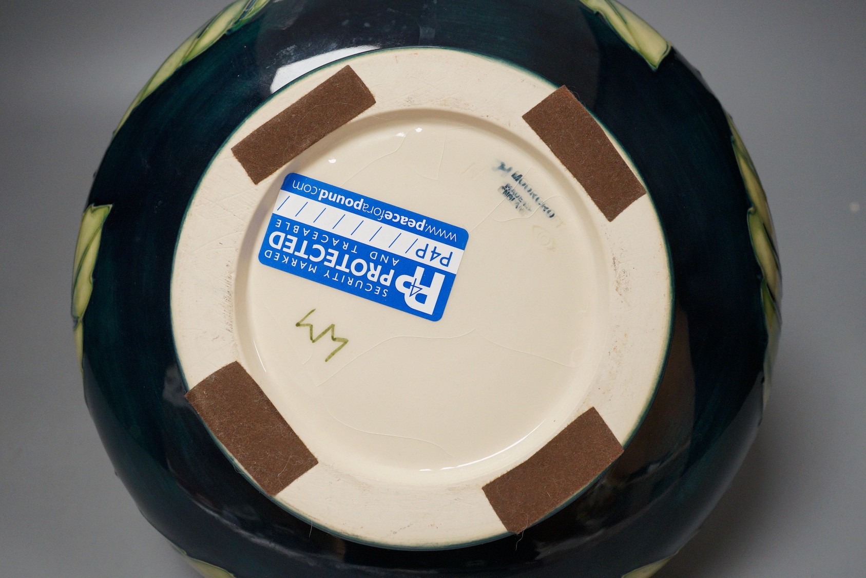 A Moorcroft pottery vase of compressed form, decorated in the 